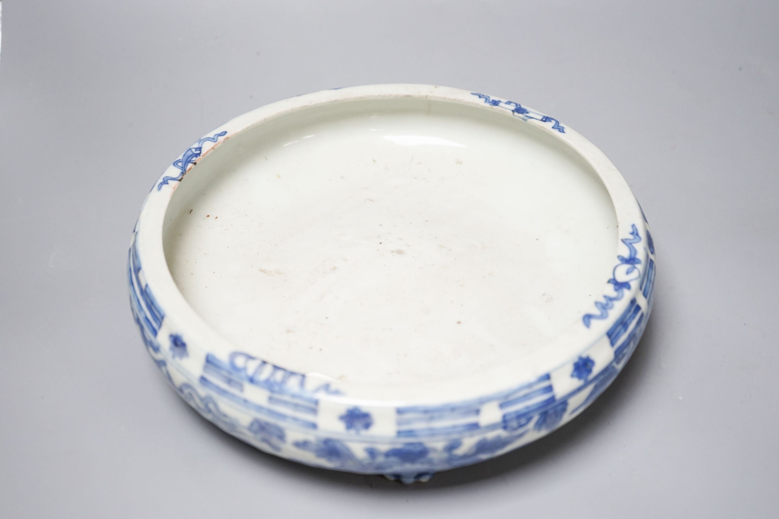 A 19th century Chinese circular blue and white censer, with phoenix and peony decoration, on three lion's paw feet 26cm